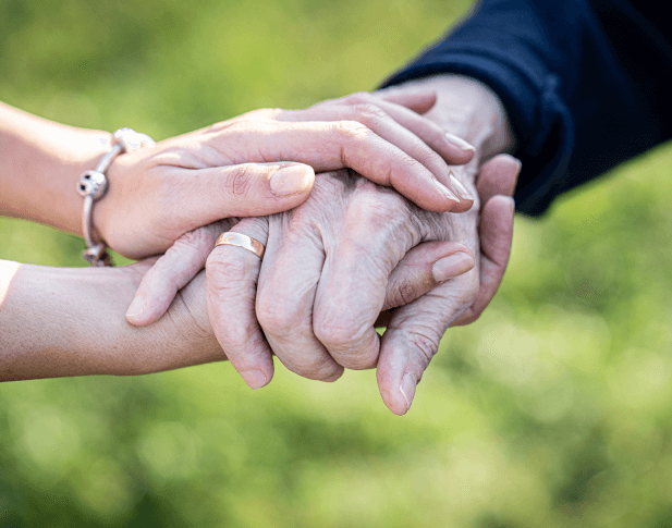 Elderly holding hands